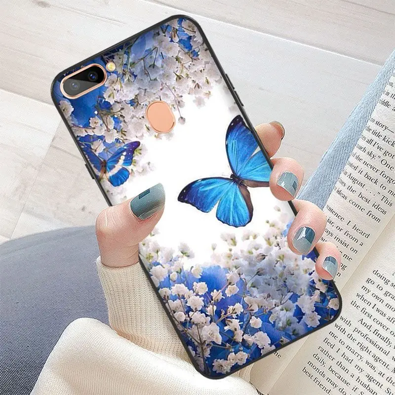 Red butterfly on white roses flower