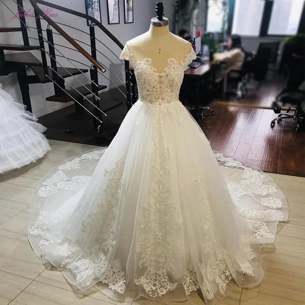

Julia Kui Classic Backless Of A Line Wedding Dresses With Delicate Pearls Of Chapel Train Princess Bridal Gown