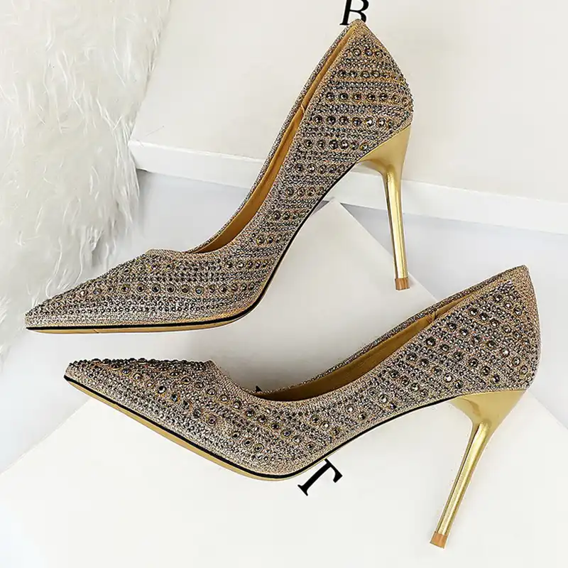 gold stiletto pumps