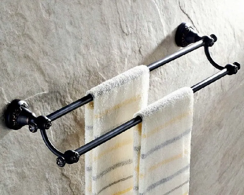 A bronze bath article rubbed with towel rack oil. Toilet paper holder. Soap holder. Towel holder. Bathroom holder
