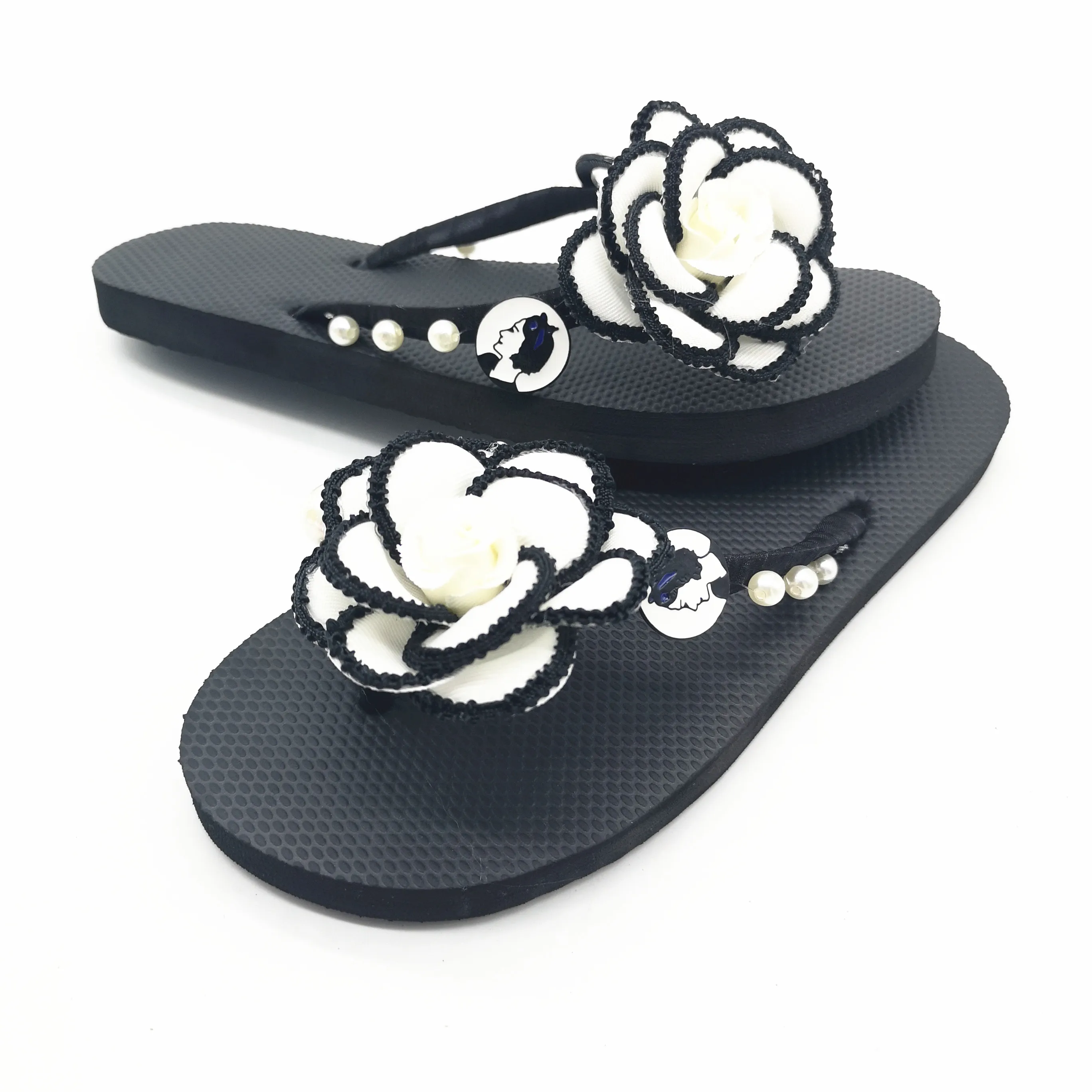 white flower flip flops