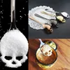 : A close-up image of the Stainless Steel Sugar Skull Spoon, a unique and creative cutlery utensil for scooping dessert, coffee, candy, and more. This durable and food-grade teaspoon is a perfect addition to any kitchen tableware collection.