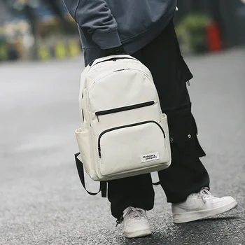 

2020 new Korean version of the campus large-capacity multi-function travel backpack retro tide simple solid color student bag