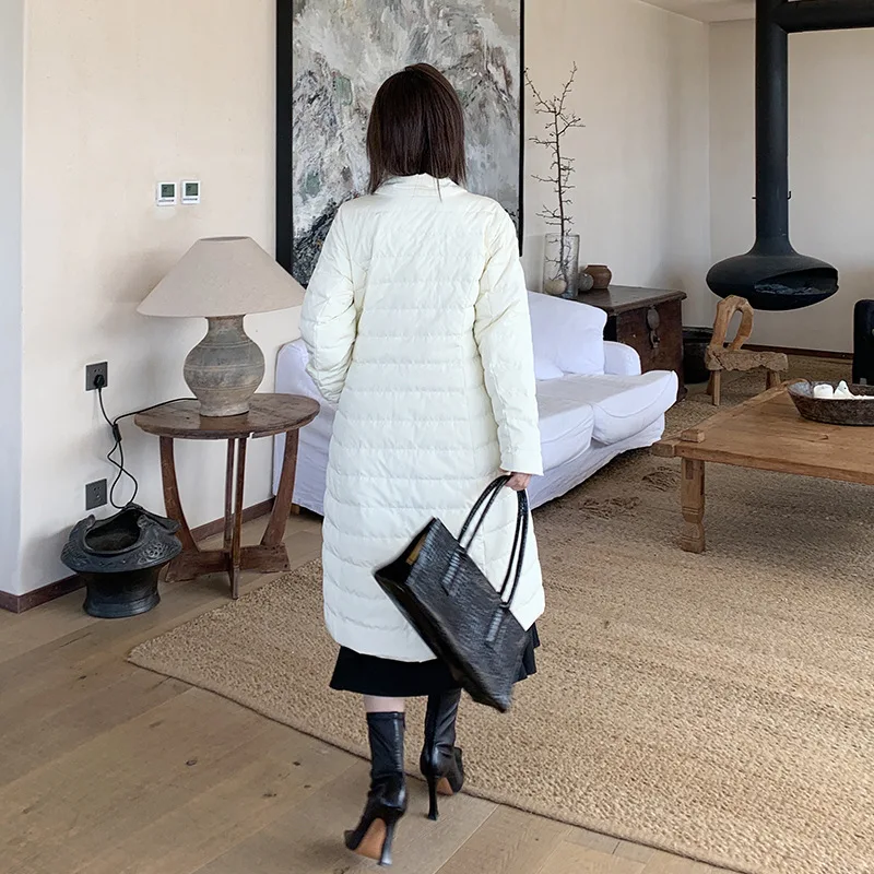Элегантная женская зимняя белая куртка пуховик средней длины с перекрестной