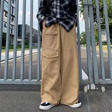 

Men Trousers Loose Silhouette Casual Pants Button Patch Bag Overalls Solid Color Tidal Current Streetwear Youth Pop Hot Sale