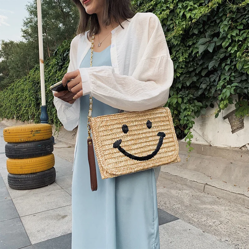 

Single shoulder slanted women's bag beach weaving straw bag Korean version of fashion casual smiling face envelope bag