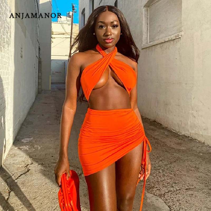 ANJAMANOR-conjunto Sexy de 2 piezas para mujer, conjunto a juego, trajes de Club de vacaciones, minifaldas, Top entrecruzado, Top corto de cuello Halter, D85BC12, 2021