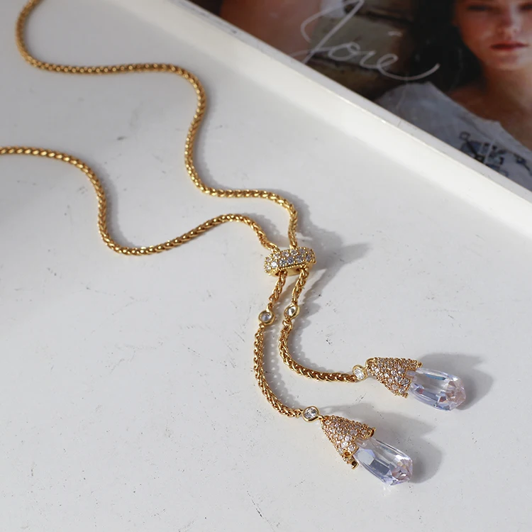 

European and American fashion brands with white crystal droplets pendant pull beans adjustable middle Necklace sweater chain