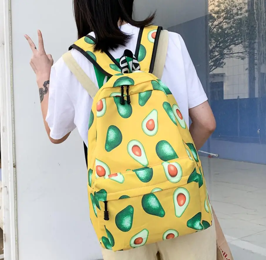 Mochila de lona con estampado de frutas de dibujos animados para mujer, morral escolar de gran capacidad para estudiantes, para viaje, con estampado de aguacate