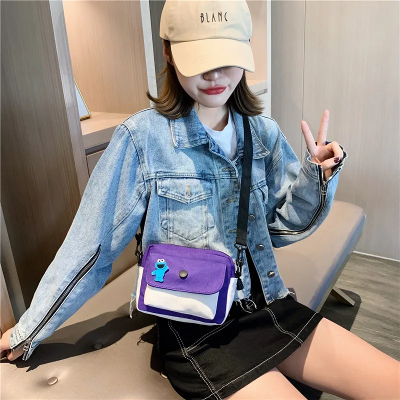 

2019 new fashion collision color small square bag canvas bag oblique span single shoulder women's bag cartoon pendant