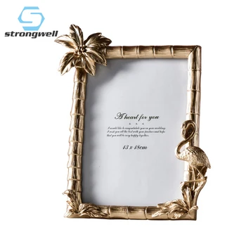 

Strongwell Exquisite Golden Flamingo Photo Frame Figurines Abstract Frame Home Decoration Accessories Living Room Wedding Gifts