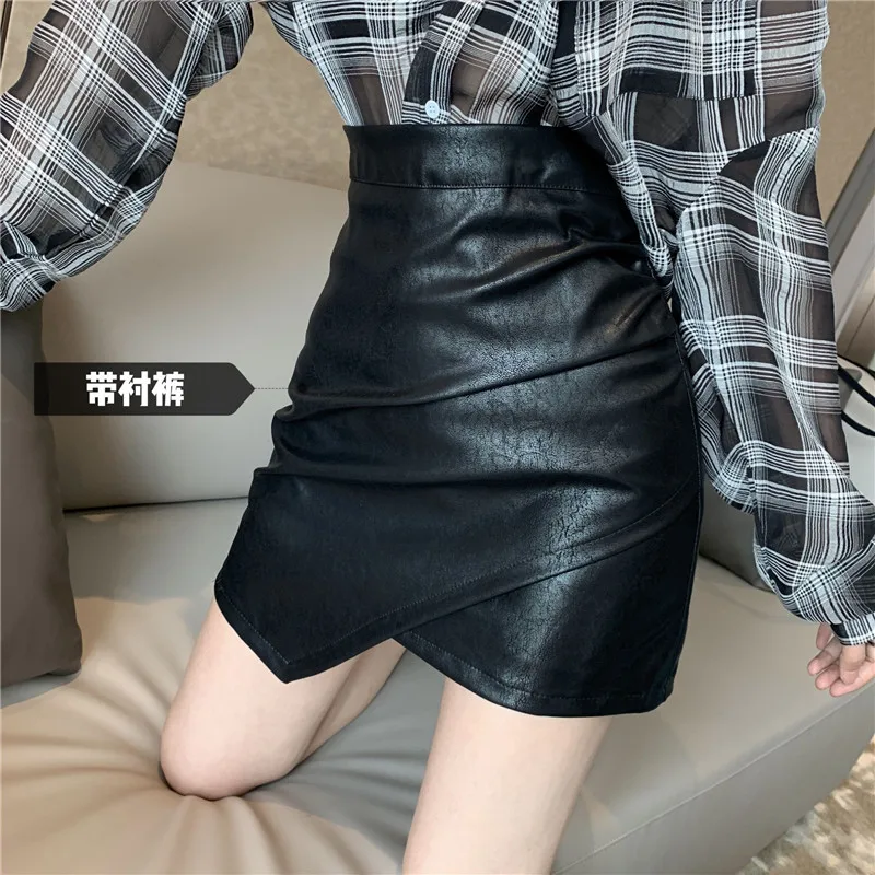 Кожаная юбка женская черная Сексуальная мини-юбка с высокой талией Женская универсальная облегающая Дамская мода Harajuku элегантная Асимметричная шикарная