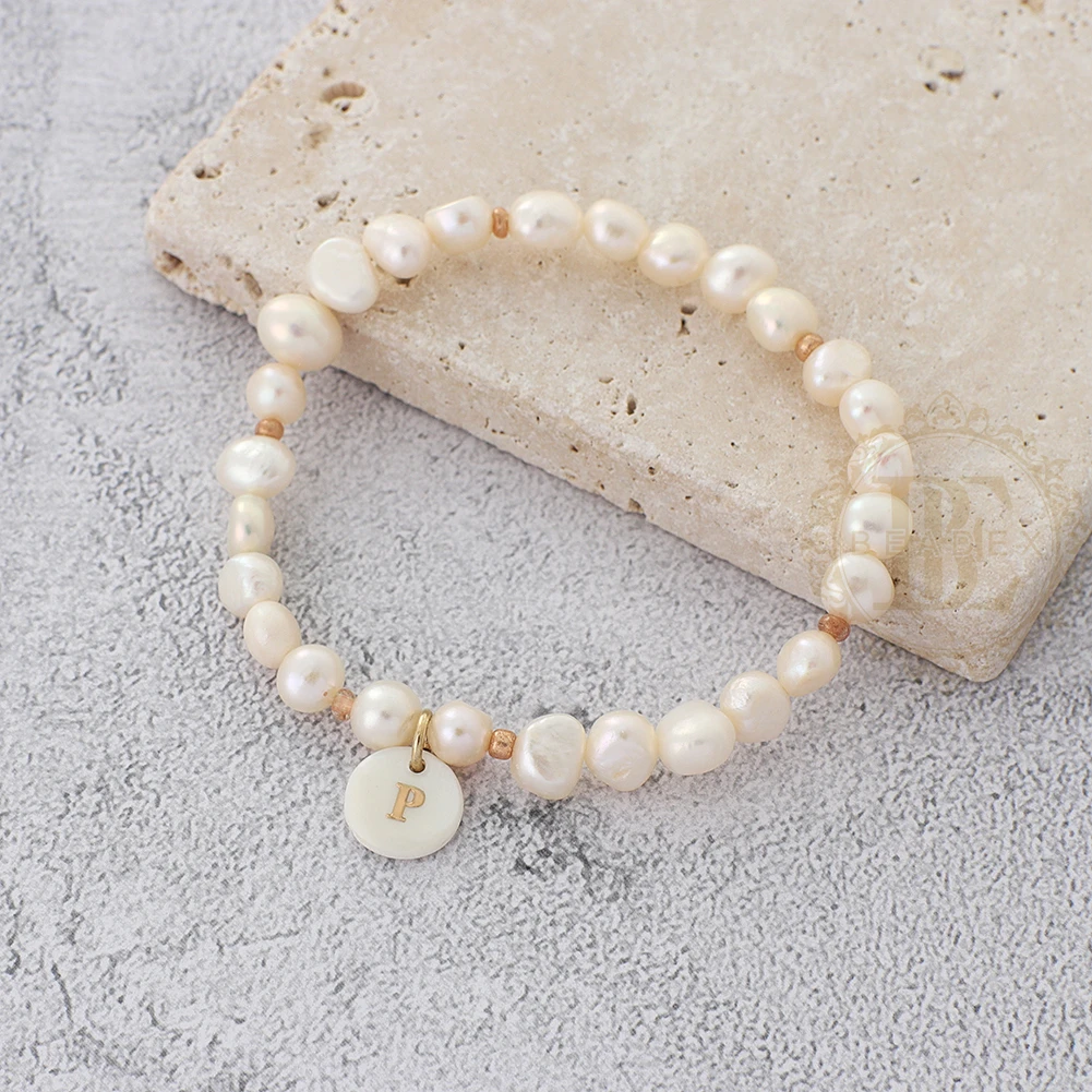 Bracelet élastique, veritables perles de culture d'eau douce et strass