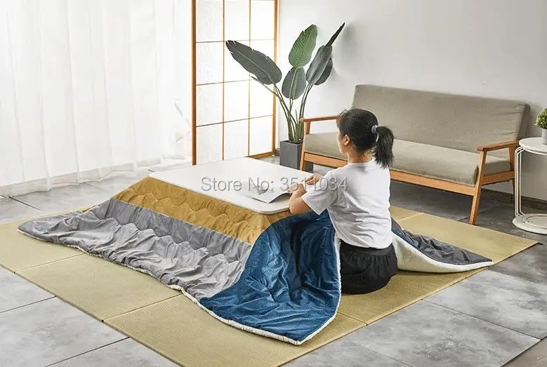 Slay winter with a heated Kotatsu table bed from Japan