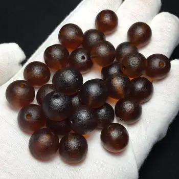 

Chinese ancient craft glass bead caramel color has particularly obvious weathering patterns diameter 14mm loose bead 30 per pack