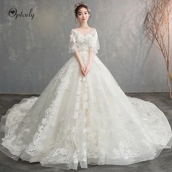 

Optcely Robe De Soiree Luxury Ball Gown Half Puff Sleeve Sexy Deep V-neck Appliques Beaded Backless Court Wedding Dresses 2019