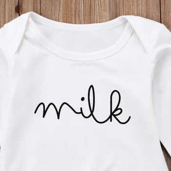 

White crawl suit. Pure colour Jumpsuit with refreshing letters of milk