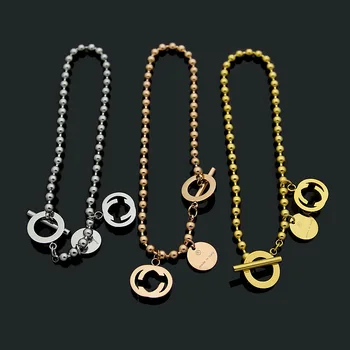 

Titanium steel jewelry hollow G letter bead chain OT buckle bracelet couple Bracelet men's and women's Bracelet