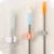 1pcs Free Punch Mop Hook Mop Hook Бесшовная Ванная Комната Mop Hook Метла Полка Mop Clip 7x7cm Для Кухни Ванная Комната Стеллаж Для Хранения TSLM1