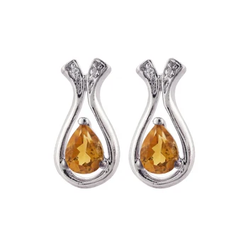 

Set in sterling silver 925mls. With set in zircons and semi-precious stone aquamarine.