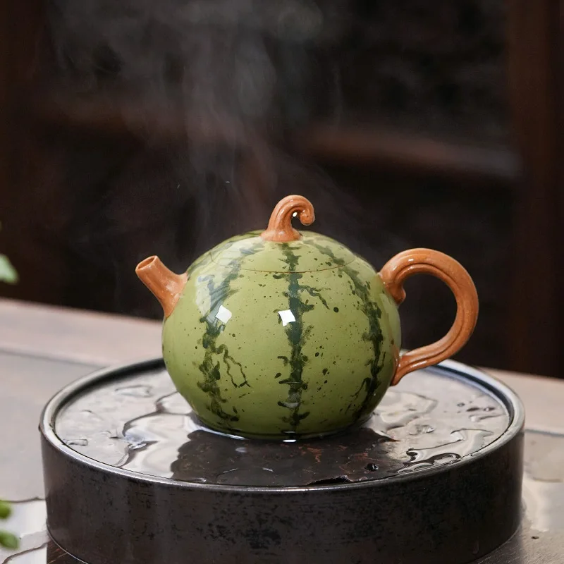 https://ae01.alicdn.com/kf/Hc590a990ea6740acac782022a34da6f0O/full-handmade-tea-pot-watermelon-shape-creative-traditional-craft-true-yixing-zisha-green-clay-pot-ball.jpg