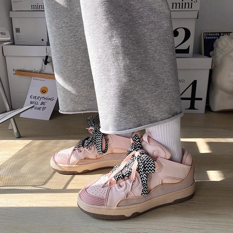 pink and silver designer sneakers
