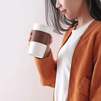 

Simple Nordic style heat-resistant ceramic cup with silicone cover, leather case, portable travel practical coffee cup Y