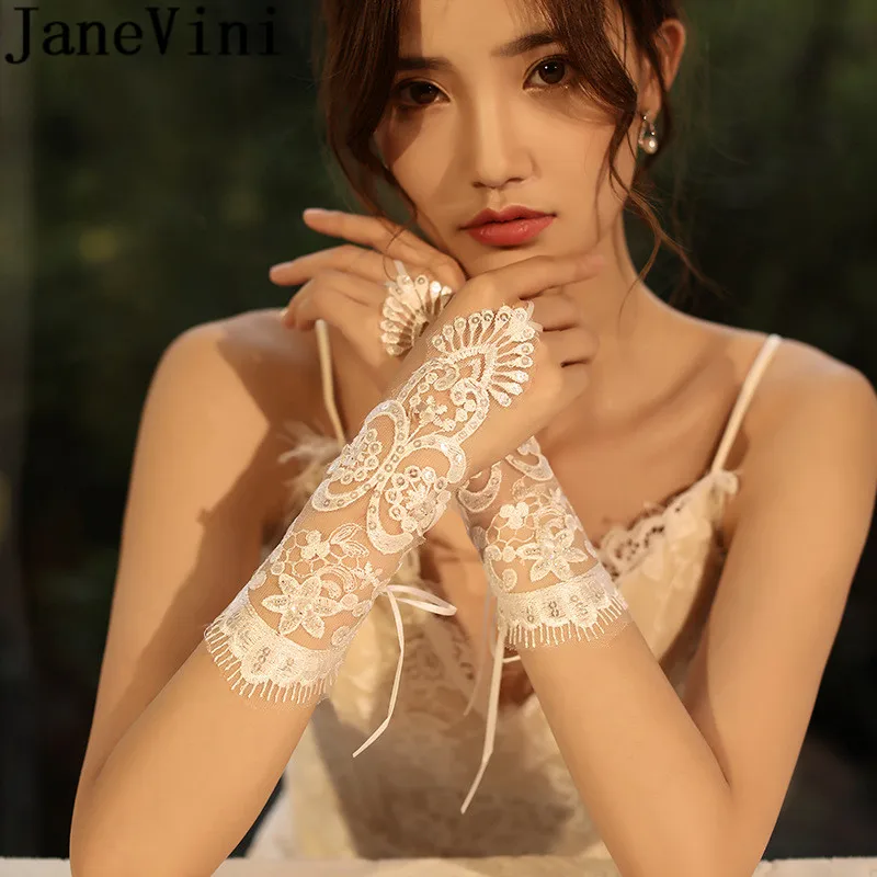 JaneVini White Sequins See Through Wedding Gloves Women Short Wrist Length Lace Bridal Gloves Bride gants courts mariage 2020