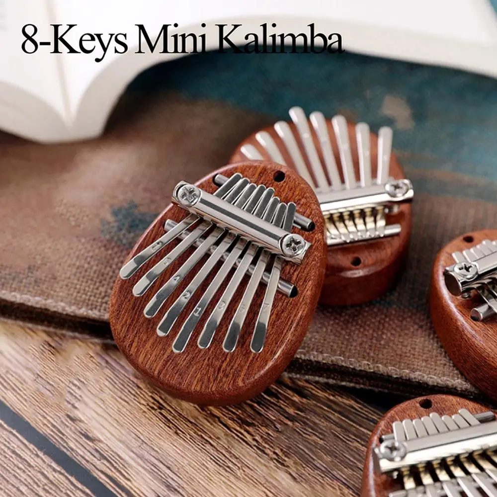 8 клавиш Овальный Kalimba портативный мини ремешок персиковый - Цена: 690,81 - 732,70 руб.