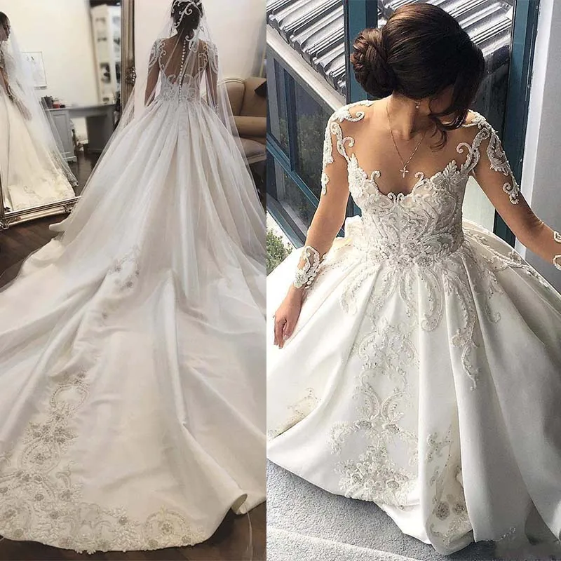 New Glamorous Lace Wedding Dress Illusion Long Sleeves Wedding Gown Sheer Neckine Covered Button Back Wedding Bridal Gowns