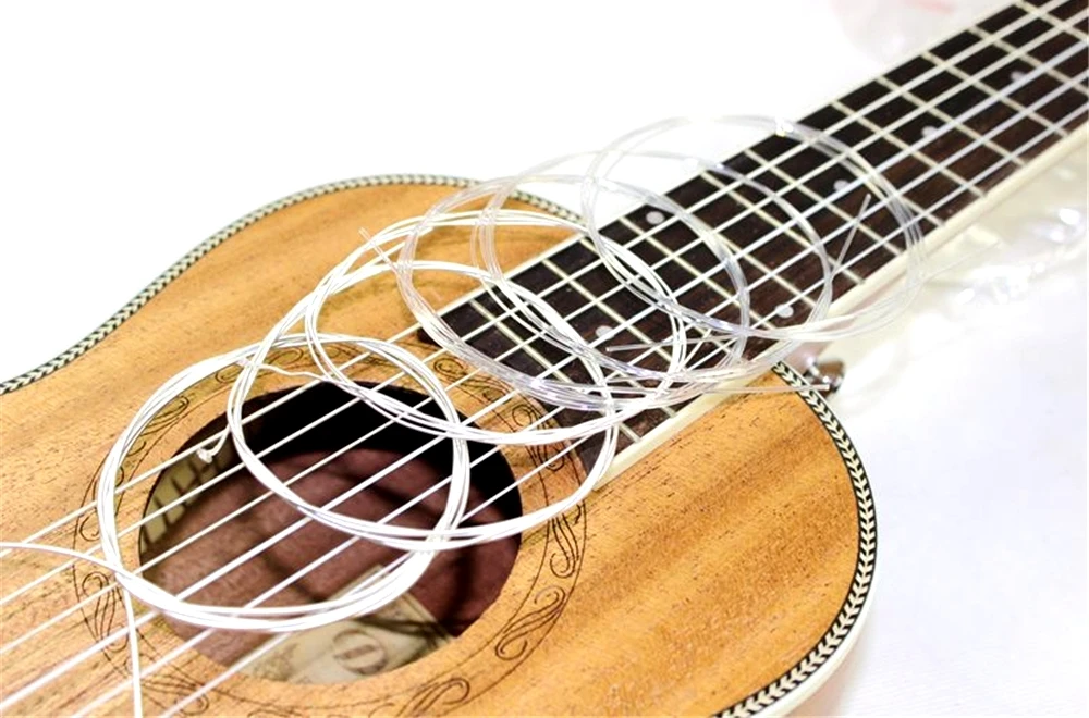 струны для акустической гитары. струны aquila. струны guitar string e-1st. нейлоновые струны на классическую гитару bellucci bc3820. бридж бас гитары.