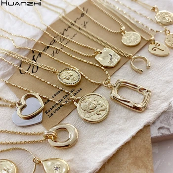 

HUANZHI 2020 New Korean Retro Abstract Irregular Human Face Angel Portrait Letters Crystal Gold Metal Pendant Necklace for Women