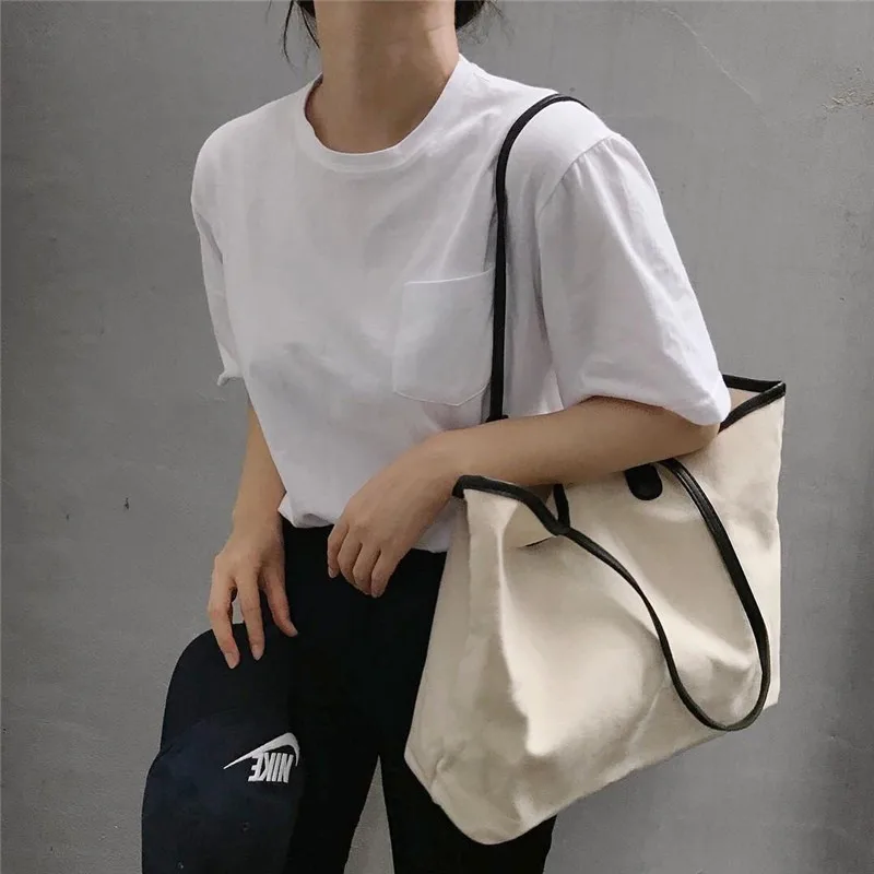 

2020 new simple and versatile canvas bag hand cloth bag shopping bag large capacity shoulder bag fashion casual female bag