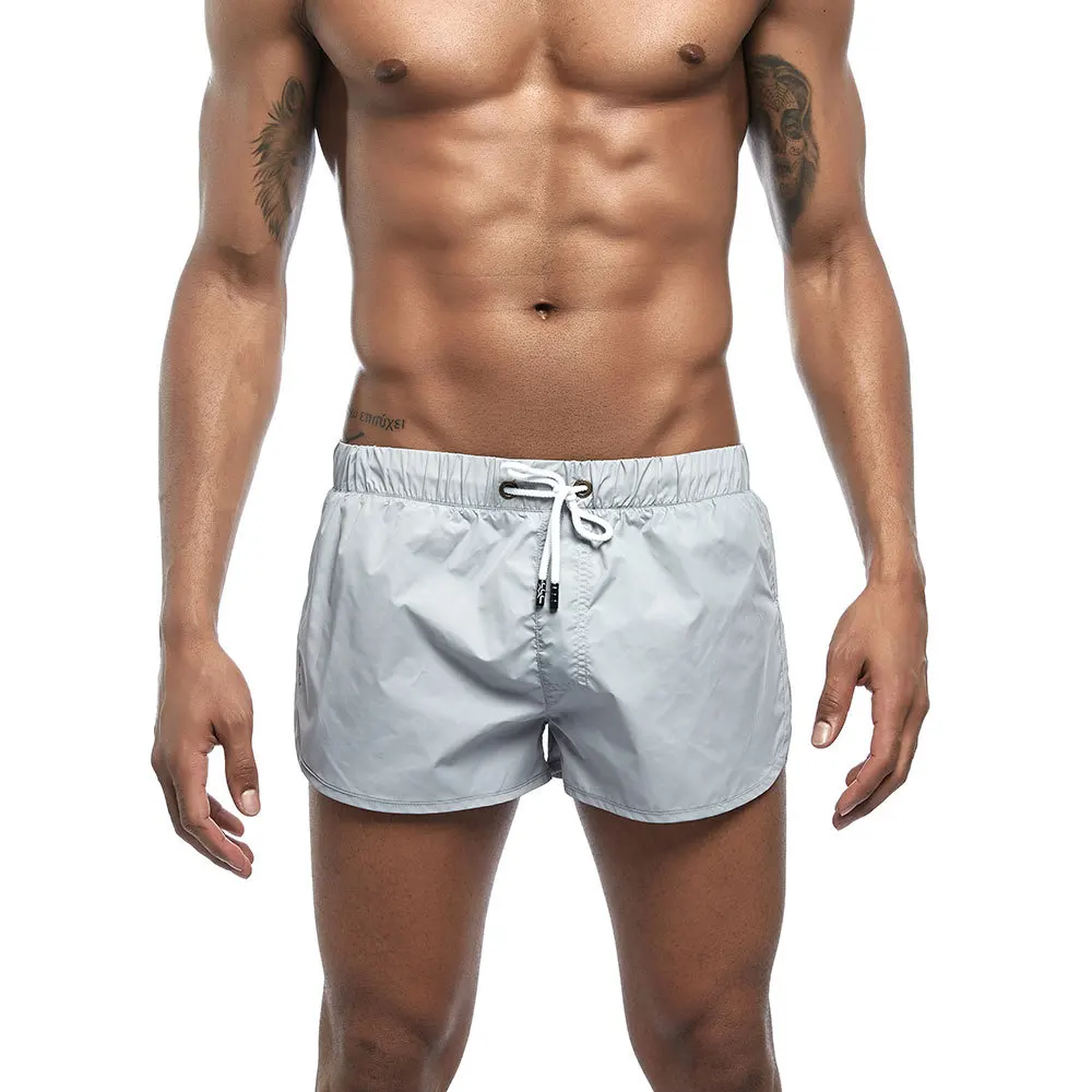 Новейшие мужские шорты для плаванья, короткие тонкие и легкие Пляжные штаны, обшитые мужские шорты, шорты для плавания, короткие спортивные мужские шорты