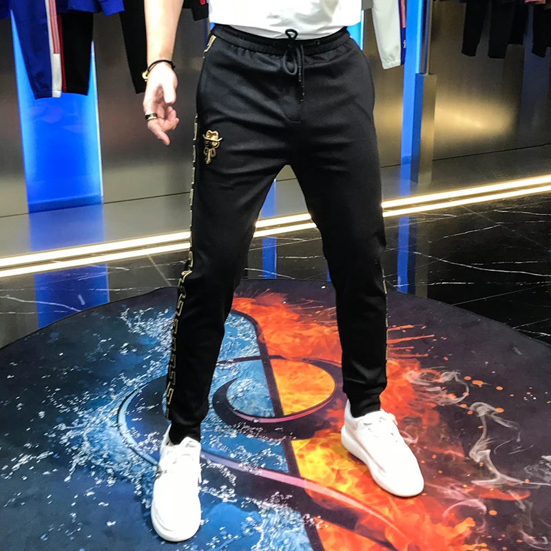 

2020 autumn new striped corset lace up casual pants for men youth embroidered badge pants men's fashion brand personality man