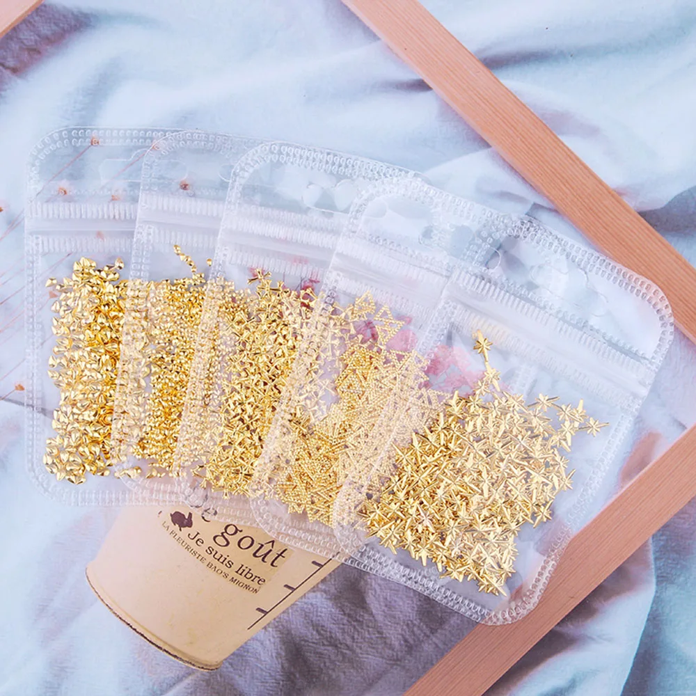 

1 bag 200-50pcs Nail Studs Nail Art Decorations Star Circle Moon Triangle Heart Square Hollow Metal Alloy Rivets Sticker Decos