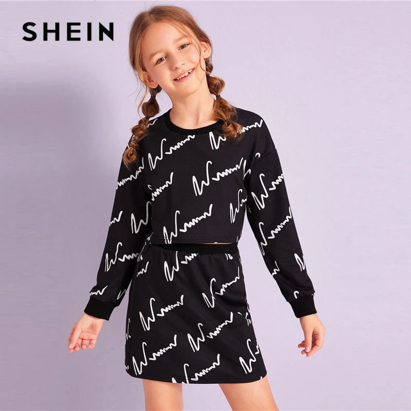 Ceny SHEIN Kiddie Girls czarna graficzna bluza z nadrukiem i spódnica zestawy dwuczęściowe zestawy dla dzieci 2019 jesień z długim rękawem strój codzienny