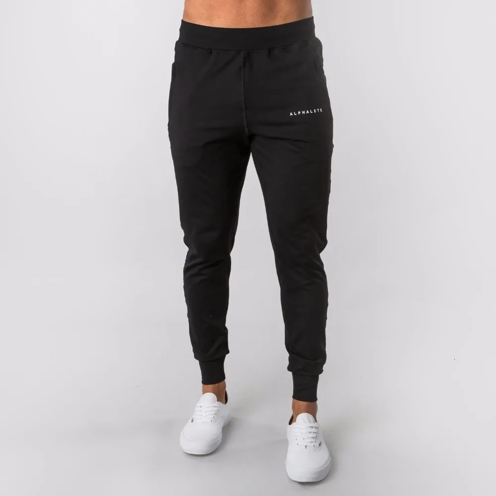 Новинка, стильные мужские спортивные штаны Alphalete Jogger, мужские спортивные штаны для тренировок, фитнеса, хлопковые мужские штаны, повседневные Модные обтягивающие спортивные штаны - Цвет: black