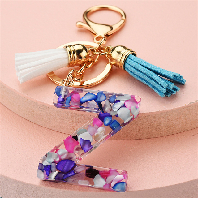 Women Keychains 26 Glitter Hollowed-out Words Handbag Tassel English Letter Keyring with Puffer Ball Charms Free Shipping