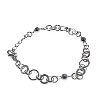 

Sterling silver bracelet combined with hoops of various shapes and balls