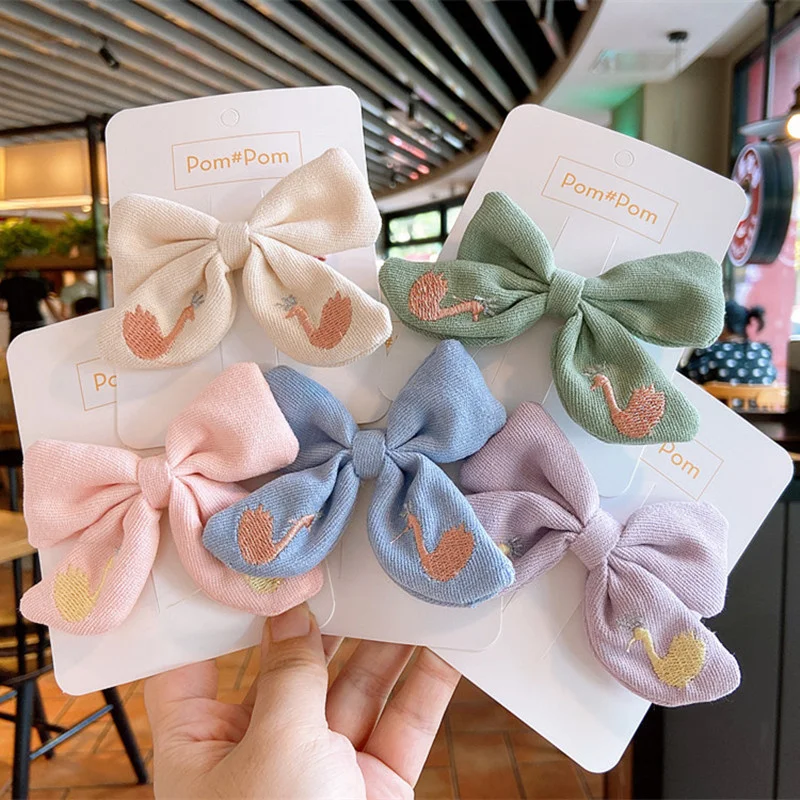 

Early Autumn New embroidered Swan bow baby girls solid color children's clip bangs hair accessories