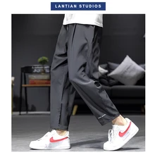 Весенние мужские черные шаровары летние Япония стиль человек уличная карго Брюки размер плюс мужской Jogger 5XL одежда