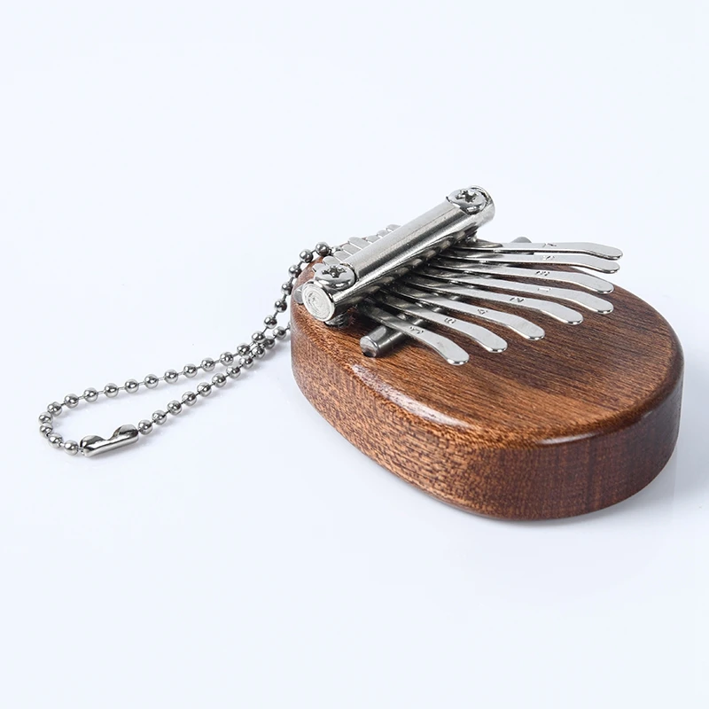 8 Keys Mini Portable Finger Kalimba Thumb Piano Portable Beginners Keyboard Instrument Christmas Toy with Lanyard