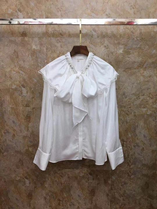 

2019 Early Autumn New Female Necktie Knotted Lotus Leaf Edge Pure Long Sleeve Hundred Lay Top 727