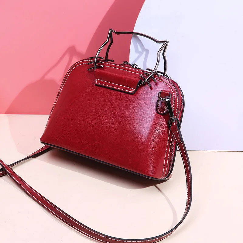 

Summer New Style Trend Genuine Leather Cowhide Fashion Metal Hand Shoulder Cute Cat Women's Bag 610429