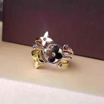 

Wholesale hollow out four leaf flower three color three piece set ring gold four leaf flower opening ring
