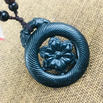 

Natural black stone Hand-carved black openwork flower pendant necklace Men and women's beautiful sweater chain