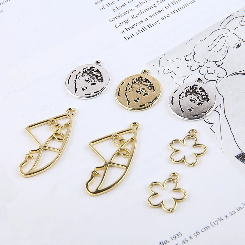 

8 Pcs Hot sale 2018 retro Hepburn avatar round abstract art face flower pendant trendy earrings for women DIY Jewelry Findings