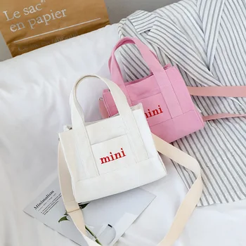 

Mini canvas bag female 2020 new wide shoulder strap shoulder messenger bag art small fresh learning portable cloth bag