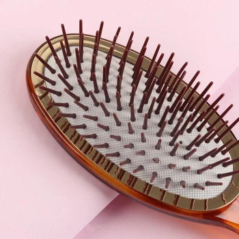 

Massage comb oval 6 * 22.5 (± 1) cm 51055 amber VORTEX 4901225